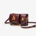 Burgundy leather crossbody bag with chic gold rabbit metal decor and chain strap fashion. - 23CM*7CM*12.5CM / Burgundy