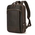 Close-up detail of the retro brown leather backpack showing durable double zippers and stitching. - Double Zippered Main Compartment / Dark Brown