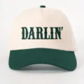Close-up detail of contrast color baseball cap featuring custom DARLIN embroidery design. - Adjustable / Beige and Dark Green