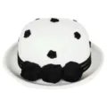 Detailed view of a vintage white wool felt bowler hat featuring chic black rose decorations. - M (56-58cm) / White