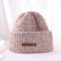 Closeup detail shot of the thick warm knit beanie hat in soft pink wool texture. - M (56-58cm) / Mocha