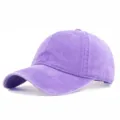 Detailed view of a vintage washed purple cotton baseball cap with curved brim and texture. - M (56-58cm) / Violet