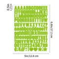 Close-up detail of green adhesive letter and number stickers sheet, showing clear fonts. - Light Green