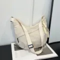 Sac bandoulière décontracté en nylon pour femmes, sac croissant uni tendance beige quotidien - Blanc Cassé