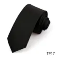Close-up of black herringbone necktie fabric, premium texture detail view for formal wear. - Herringbone