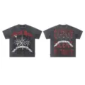 Vintage acid wash graphic t-shirt featuring rhinestone letters and gothic streetwear style. - S / Tops / Black