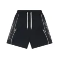 Black casual shorts featuring tribal side prints, elastic waistband, and white contrast drawstrings. - Black