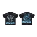 Black washed streetwear short sleeve t-shirt with blue flame skull graphic and gothic text logo. - S / Tops / Washed Black
