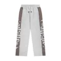 Detailed view of gothic letter embroidered colorblock sweatpants, casual streetwear style. - S / Gray