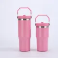 Stainless steel vacuum insulated tumbler with portable handle in pink color for outdoor travel. - 20oz / Pink