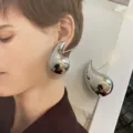 Silver metallic teardrop earrings, French niche design, elegant statement jewelry for women. - Teardrop Earrings / Silver