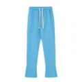 Vista dettagliata dei pantaloni della tuta Y2K blu con un cordino spesso e del testo. - Taglia S / Pantaloni e gonne / Blu
