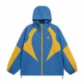 Blue and yellow colorblock hooded windbreaker jacket detail showcasing fine embroidery design. - S / Tops / Blue and Yellow