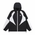 Close-up detail view of the black and white color-blocked hooded windbreaker jacket. - S / Tops / Black And White
