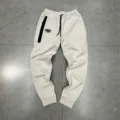 Comfortable fleece-lined streetwear jogger sweatpants with zip pocket and drawstring waist. - M / Bottoms / Apricot