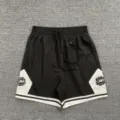 Black and white colorblock athletic shorts with drawstring waist and streetwear style. - S / Bottoms / Black