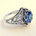 Vintage blue gemstone ring with intricate gothic floral leaf hollow carved silver band details. - Size 6 / A302 Antique Silver
