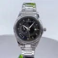 Detail view of men's stainless steel quartz watch with black dial and calendar display. - Silver Case Black Face