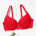 Closeup view of red lace bra featuring thin straps, scalloped edges and center bow detail. - Red