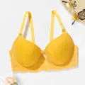 Close-up detail view of the vibrant yellow lace bra cup and delicate bow decoration. - 36/80B / Yellow