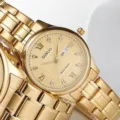 Montre à quartz dorée DINUO pour hommes et femmes, bracelet en acier, double calendrier. - Cadran Doré Bracelet Doré Femmes