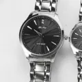Stainless steel quartz watch with black sunburst dial and metal strap for men and women. - Men's Silver Case with Black Dial