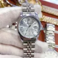 Stylish women's quartz watch with steel strap, textured silver dial and date display. - Silver Case Light Blue Dial