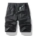 Detailed view of men's casual cargo shorts featuring multiple pockets and metal zipper fly. - 30 / Dark Gray