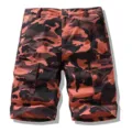 Men's orange camouflage cargo shorts with multiple practical zip pockets for outdoor wear. - Brick Red Camouflage