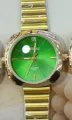 Vintage gold wristwatch featuring a striking green dial and stylish bamboo link strap design. - Gold Green Dial