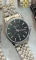 Orologio al quarzo con cinturino in acciaio, quadrante verde scuro e data utile. - Cassa Argento Quadrante Nero