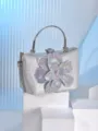 Detailed view of the silver sequin rhinestone flower evening bag, highlighting the sparkling crystals. - Silver