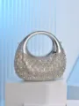 Detailed view of a stunning silver rhinestone crescent evening bag with acrylic hard shell. - Silver
