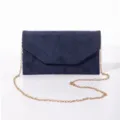 Navy blue glitter suede evening bag detail showing gold chain strap and envelope flap design. - Navy Blue