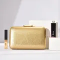 Elegant gold evening clutch bag with subtle texture for luxury parties and weddings. - Gold