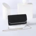 Elegant black glitter evening clutch with gold edge trim and fine chain strap detail. - Black