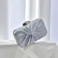 Detailed view of the elegant silver pleated evening clutch bag, perfect for banquets and parties. - Silver