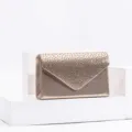 Gold evening clutch detail shot, rhinestone embellished envelope flap design, premium accessory. - Champagne