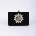 Black velvet evening clutch bag with sparkling rhinestone flower and gold frame for dress. - Black