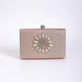 Close-up of crystal flower and glitter texture on the elegant evening clutch bag. - Pink