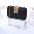 Black glitter evening clutch bag with gold chain and rhinestone clasp for party events. - Black