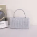 Silver pleated evening handbag, stylish glitter clutch purse with top handle for women detail view. - Silver