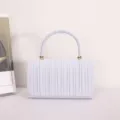 Elegant white pleated handbag with round handle and gold-tone accents for women evening party - White