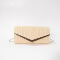 Beige woven envelope clutch bag featuring a sleek gold V-shaped metal clasp and strap. - Champagne