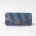 Blue woven texture envelope clutch bag with gold metallic V-clasp and chain strap detail. - Blue