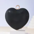 Black heart-shaped rhinestone clutch bag with gold metal frame and ring clasp for evening party. - Black