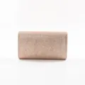 Close-up view of the glittering rose gold evening clutch bag showing its fine texture. - Gold
