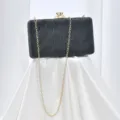 Elegant black evening clutch bag with sparkling diamond clasp and chic gold chain strap for party. - Black