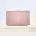 Pink glitter clutch detail view, featuring sparkling finish and a sleek metal clasp closure. - Champagne