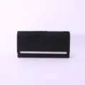 Detail shot of black glitter clutch evening bag with pleated texture and sleek metal bar closure. - Black